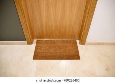 Brown Welcome Mat At Front Door