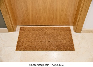 Brown Welcome Mat At Front Door