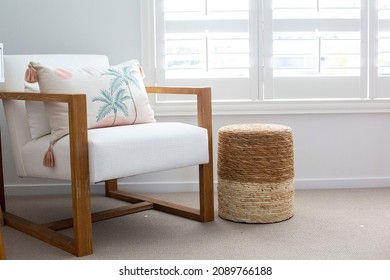 Brown and White Assent Chair, Coastal modern living room styling statement chair, white linen palm tree cushion coastal lounge chair, White House interior styling brown white chair living room - Shutterstock ID 2089766188