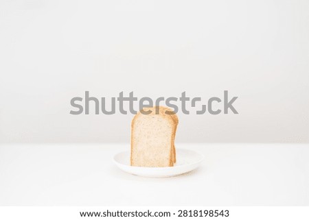 brown whole wheat bread slice on plate. Weight loss management, Dieting, Healthy eating, Calorie control, Fitness food, High fiber, Wellness, Lifestyle, Metabolism and Glycemic Index