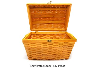 A Brown Wicker Basket, With Lid Open, On White