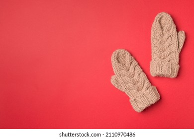 Brown Winter Mittens On Wooden Background. Top View.