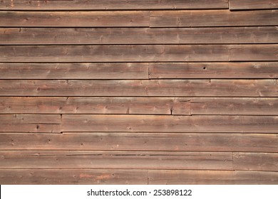 Brown Wood siding boards. Old and weathered.