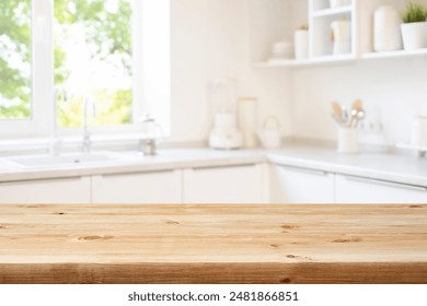 Brown wood table top over blurred kitchen counter interior background with window