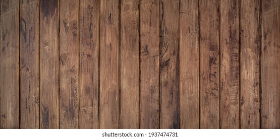 Brown wood texture background coming from natural tree. The wooden panel has a beautiful dark pattern, hardwood floor texture - Shutterstock ID 1937474731