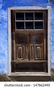  brown wood   window in a blue wall arrecife lanzarote spain - Shutterstock ID 147862490