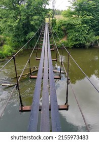 Brown Wooden Bridge Over River