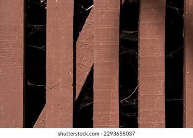 Brown wooden fence with spider webs  - Powered by Shutterstock