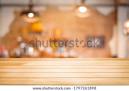 Brown Wooden table on coffee shop or restaurant background .