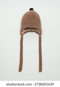 Brown wool trapper hat with pom-pom