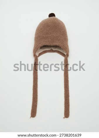 Brown wool trapper hat with pom-pom