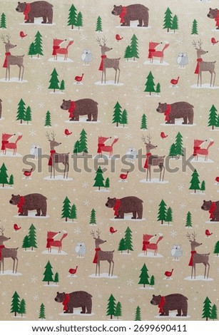 A brown wrapping paper background in a pattern of forest animals