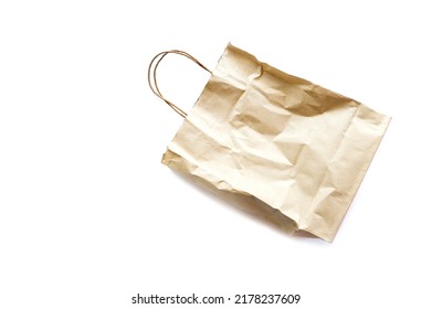 Brown Wrinkled Paper Bag Isolated On White Background.