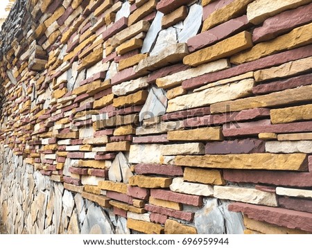 Brown and yellow sandstone tiles texture for wall decoration, for background.
