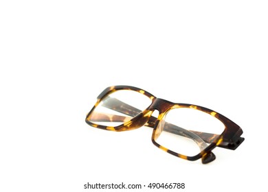 Brown And Yellow Vintage Plastic Eyeglasses On White Background