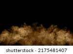 Brown-black dust powder explosion. The texture is abstract and splashes float. on a black background