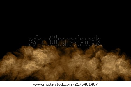 Brown-black dust powder explosion. The texture is abstract and splashes float. on a black background