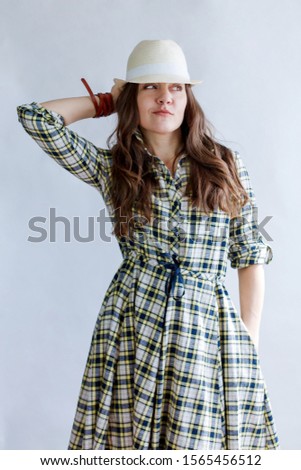 Similar – young beautiful lady posing in the living room next to a window