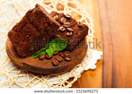 Similar – Chocolate brownie pieces on wooden background