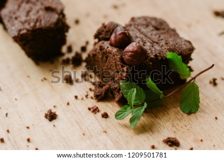 Similar – Chocolate brownie pieces on wooden background