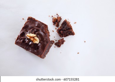 Brownie With Crumbs On The White Background