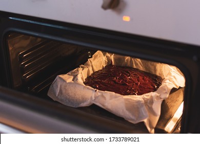 brownie in the hot oven - Shutterstock ID 1733789021