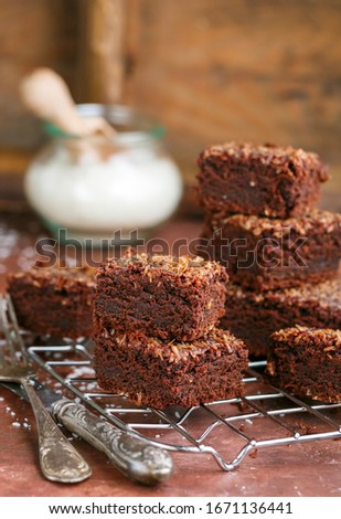 Similar – Image, Stock Photo stack of baked square pieces of chocolate brownie cake