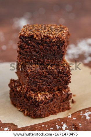 Similar – Image, Stock Photo stack of baked square pieces of chocolate brownie cake