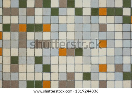 brownish mozaic tiles in a bathroom pattern with brown, white , yellow and green small tiles