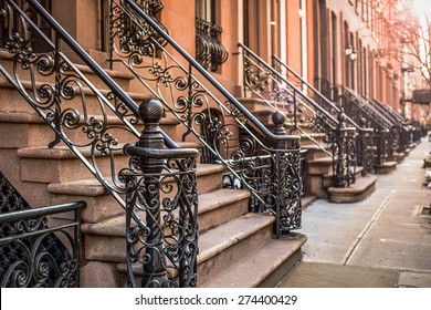 Brownstone apartment building entrances in New York City.