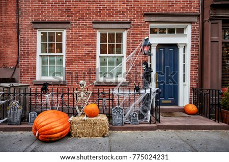 a brownstone building decorated for halloween