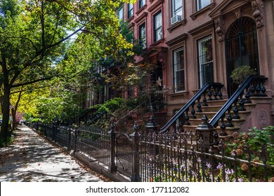 Brownstone Homes Along Residential Neighborhood Sidewalk In Brooklyn New York