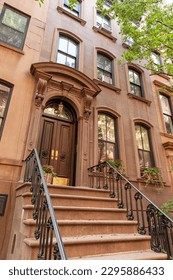 Brownstone townhouse apartment on Perry Street in the Greenwich Village district of New York City, USA