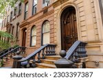 Brownstone townhouse apartments on Perry Street in the Greenwich Village district of New York City, USA