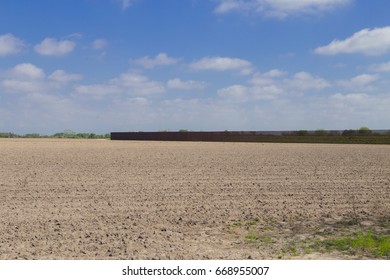 Brownsville, TX - February 18, 2017: Border Fence Stretches On Privately Owned Land, Separating U.S. From Mexico. 