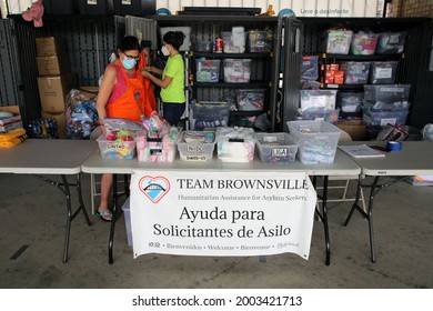 Brownsville, TX, USA - May 29, 2021:  Carol Ford And Zeuzette Cordero Work At The Migrant Aid Organization Team Brownsville's Booth At The Brownsville Bus Station.