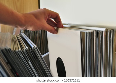 Browsing Through Vinyl Records Collection. Music Background.