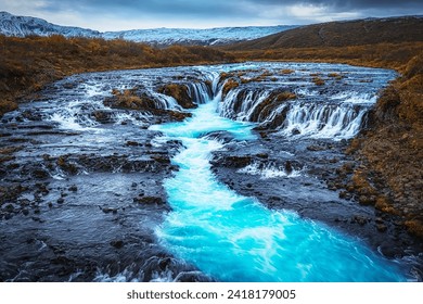 Bruarfoss (Bridge Fall), is a waterfall on the river Bruara, in southern Iceland where a series of small runlets of water runs into a beautiful, turquoise-blue colored pool