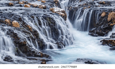 Bruarfoss is renowned for its stunning turquoise waters, created by glacial melt flowing through volcanic rock formations, offering a picturesque and serene sight. - Powered by Shutterstock