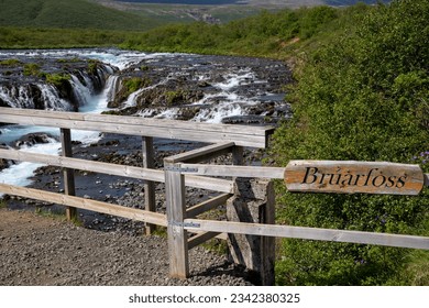 Bruarfoss waterfall on a sunny day in summer. Features beautiful teal turquoise water in Iceland along the Golden Circle area