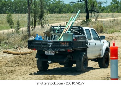 Bruce Highway Townsville To Mackay, Queensland, Australia - November 2021: A Truck Laden With Road Works Equipment At A Work Site On Highway Construction