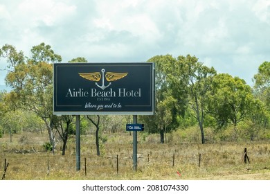 Bruce Highway Townsville To Mackay, Queensland, Australia - November 2021: Outdoor Roadside Advertising Billboard For Airlie Beach Hotel