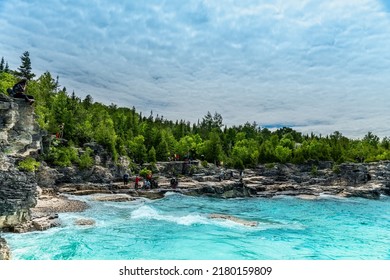 Bruce Peninsula National Park, Canada – June 27, 2022: Colourful Green Waters At Indian Head Cove On Lake Huron In Bruce Peninsula National Park And Clear Blue Water In Ontario Located Near Grotto.