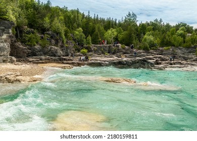 Bruce Peninsula National Park, Canada – June 27, 2022: Colourful Green Waters At Indian Head Cove On Lake Huron In Bruce Peninsula National Park And Clear Blue Water In Ontario Located Near Grotto.