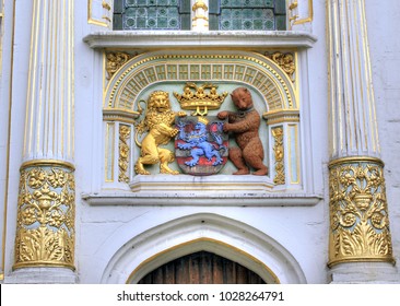 BRUGES - BELGIUM / 07.28.2012:  Flemish Coat of Arms on the City Hall in Bruges. The shield is the flag of Flanders flanked by a gold lion and brown bear