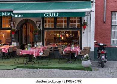 BRUGES, BELGIUM - AUGUST 09, 2022:  Exterior Of Venezia Del Nord Restaurant With Outside Seating