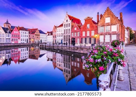Bruges, Belgium. Blue hour sunrise landscape with water reflection houses on Spiegelrei Canal, famous Flanders landmark.