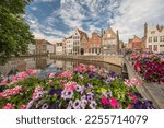 Bruges Belgium, city skyline at Spiegelrei Canal with summer flower