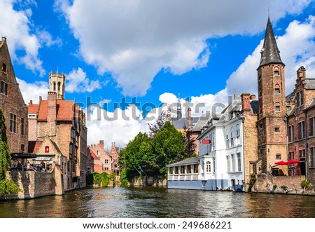 Bruges, Belgium. Image with Rozenhoedkaai in Brugge, Dijver river canal with Belfort (Belfry) tower. Flanders landmark.