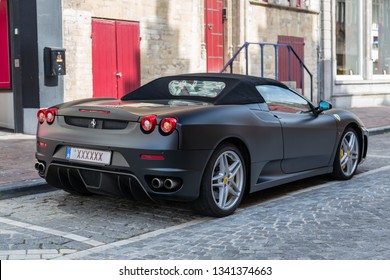 Bruges, Belgium - July 19 2014: Black Ferrari F430 Spider with special plate "XXXXXX" on display in the city center of Bruges